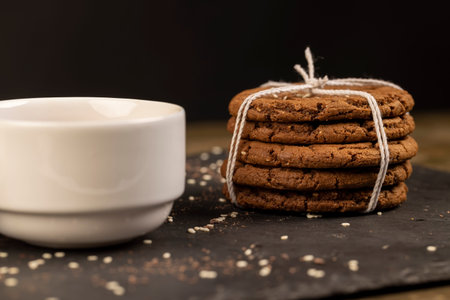 chocolate biscuits with white sesame seeds and cocoa powder, sweet chocolate-flavored biscuits with...