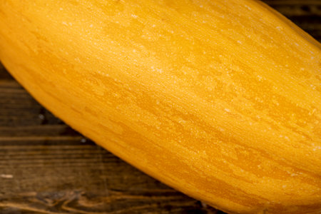 natural yellow-orange peel of a ripe pumpkin or zucchini, peel of a ripe zucchini close up, side viewの写真素材