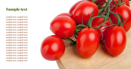 fresh tomatoes on wooden board isolated on white backgroundの写真素材