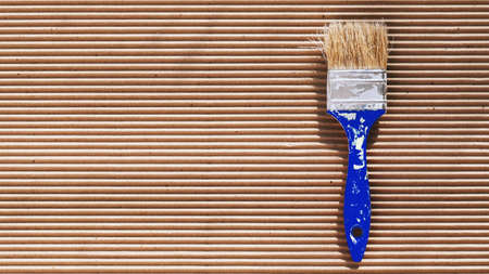 Old paint brush with colorful paint. Painting tools and accessories for home renovation. Paintbrush copy spaceの写真素材