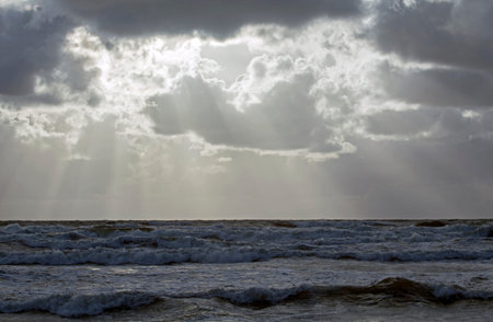 Beautiful evening clouds over the storming Bali Sea