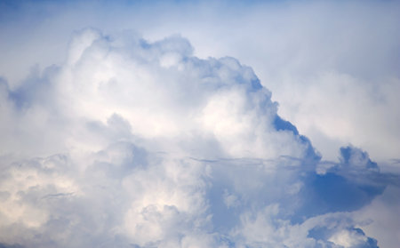 Cumulus clouds in the sunset light. Abstract composition of dramatic sky.の写真素材