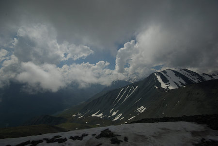Mountain landscape. Highlands, the mountain peaks, gorges and valleys. The stones on the slopes.
