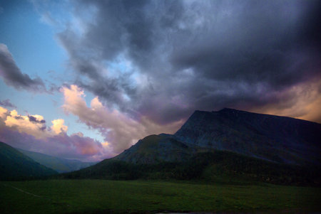 Mountain landscape. Highlands, the mountain peaks, gorges and valleys. The stones on the slopes.
