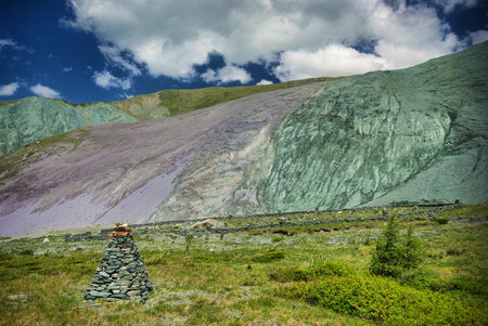 The mountain river in the mountains. Current through the gorge the river. Stones and rocky land near the river. Beautiful mountain landscape.の写真素材