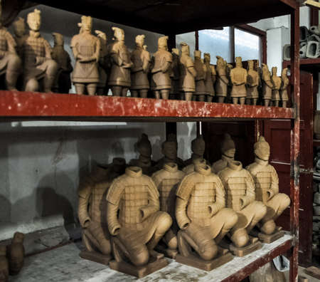 XIAN, CHINA - October 29, 2017: Clay busts in the museum. Souvenir workshop of the terracotta army. Souvenirs in the museum of the terracotta army.のeditorial素材