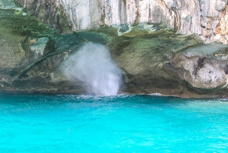 Splashes of waves on the rocks in Phuket.の写真素材
