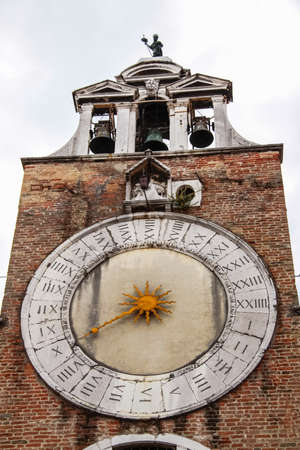 Venice, Italy - May 29, 2016: The clock on the castle tower. Venice in Italy, the architecture of the city, Venice is a popular tourist destination of Europe.のeditorial素材