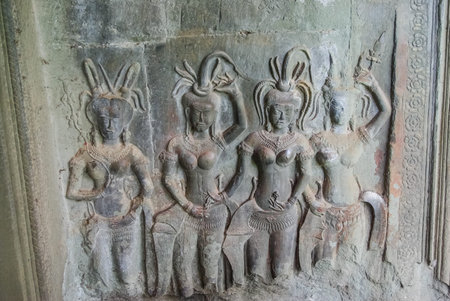 Bas-reliefs on the walls of the Angkor. Stone Gate of Angkor Thom in Cambodia, Siem Reap Angkor