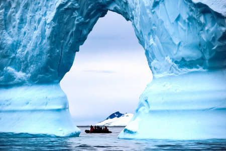 The landscape of the coast of Antarctica, Mountains covered with snow and ice-cold ocean.の写真素材