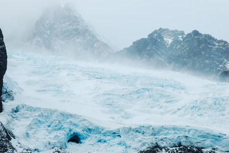 The landscape of the coast of Antarctica, Mountains covered with snow and ice-cold ocean.