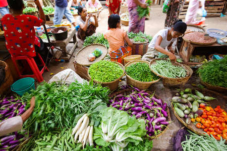 Bangkok, Thailand - August 24, 2018: Shop on the market in Bangkok, people sell fruit and seafood.のeditorial素材