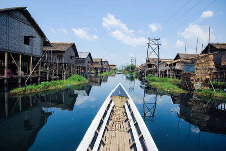Inle Lake, Myanmar - June 23, 2015: Wooden houses on the water on stilts, a fishing village on Inle Lake in Myanmar.のeditorial素材