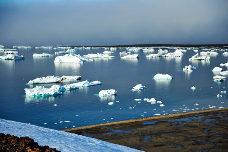 Arctic iceberg in the ocean. Arctic landscape, arctic tundra and ice of the Arctic Ocean.