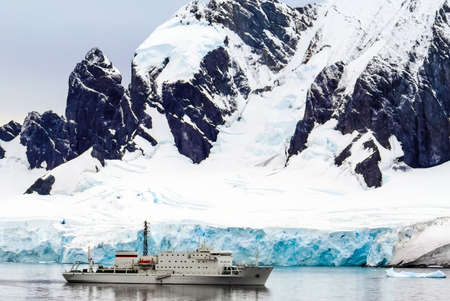 White research ship in the ice of Antarctica.の写真素材