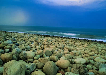 Round stones on the seashore.の写真素材