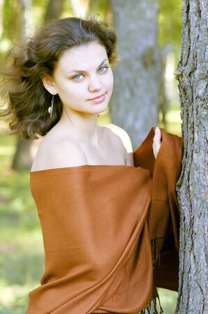 Beautiful woman near the treeの写真素材