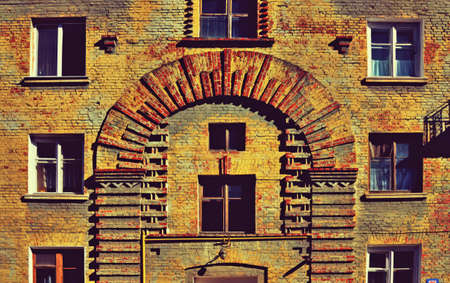 Brick wall texture in mystical old house with many windows (abstract background, vintage, grunge - concept)の写真素材