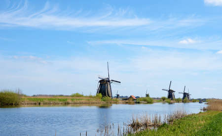 The picturesque landscape with aerial mills on the channel in Kinderdiyk, Netherlandsのeditorial素材