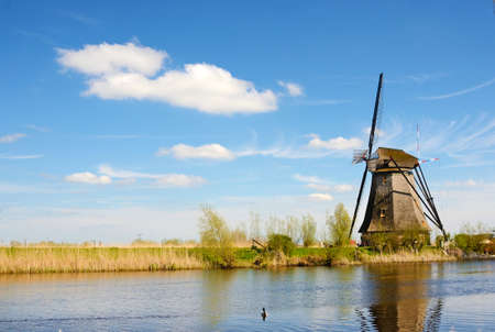 The picturesque landscape with aerial mills on the channel in Kinderdiyk, Netherlandsのeditorial素材