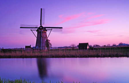 The picturesque landscape with aerial Mill on the channel in Kinderdiyk, Holland at sunsetのeditorial素材