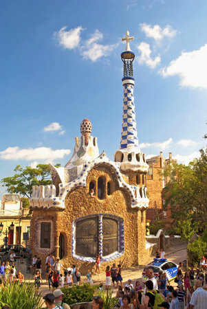 Modern building at the entrance toPark Guell in pastel tones in Barcelona, Spain