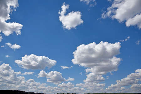 Mystical rows of clouds in the sky (natural background - concept)の写真素材