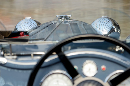 Headlights retro car. Speedometer with sensors and steering wheel.