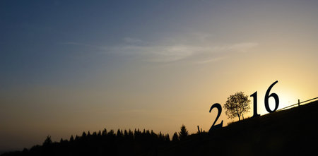 Christmas motif of figures in 2016 against the background of sunrise (2016, New Year card -...