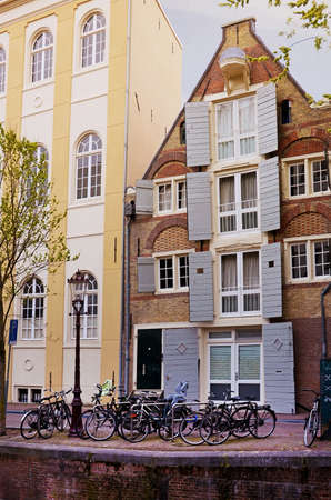 Cityscape with bikes and beautiful house in Amsterdam, Netherlandsの写真素材