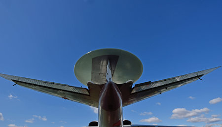 A fragment of the plane antenna against the sky in flight