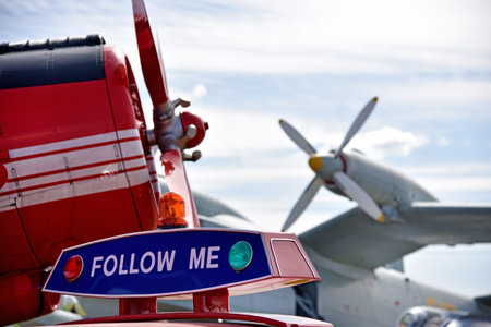Aircraft propellers of planes in the airport and the car with the words Follow me (Children's Dreams...