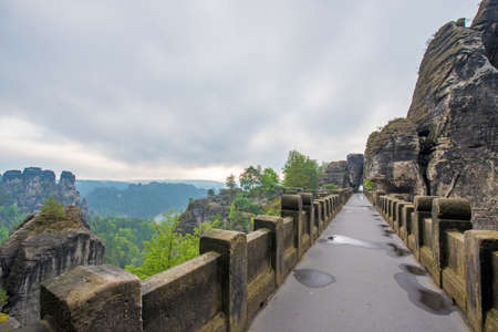 Bridge between rocks near Rathen, Germany, Europe (Sachsische Schweiz)の写真素材