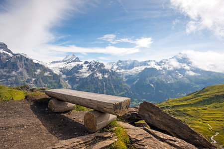 The picturesque landscape with a bench and a view of the mountains in the Swiss Alps, Europeの写真素材