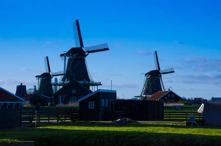 Mystic scene with air mill in Zaanse Schans, Holland, Europe backlit.の写真素材