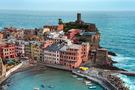 Beautiful landscape with colorful houses and boats on the cliffs in Vernazza, Cinque Terre, Italy, Europeの写真素材
