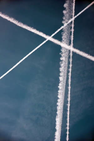 Patterns in the sky from traces of an airplane in the form of geometric shapesの写真素材