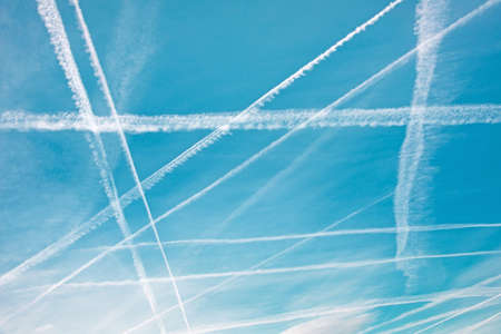 Patterns in the sky from traces of an airplane in the form of geometric shapesの写真素材