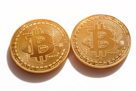 Two bitcoins on a white background