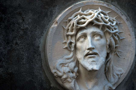 The face of Jesus Christ in a crown of thorns as a symbol of suffering and salvation of mankind. (healing, spiritual development, religious events - the concept)の写真素材