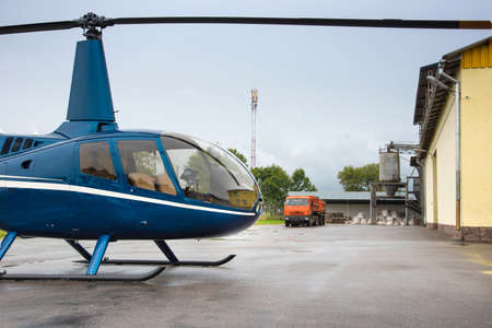 helicopter and truck near the warehouse with flourの写真素材