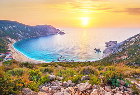 Fantastically beautiful scenery with the beach at sunset in Petani Beach, Kefalonia, Greece. Amazing places. Tourist Attractions.の写真素材