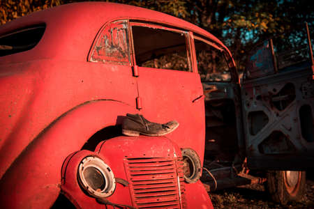 abstract image of the retro car and shoes. (decay, crisis - concept)の写真素材