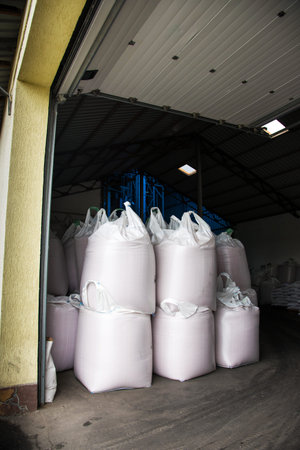Abstract agrarian image with bags of grain in the agricultural sector in the farm. (good harvest,...