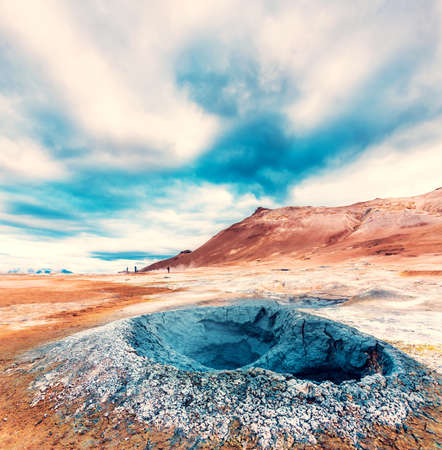 Magical dramatic scene with geothermal swamp and volcanoes  in Hverir (Hverarond) valley  in the Myvatn region. Iceland. Exotic countries. Amazing places.の写真素材