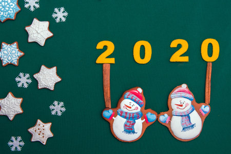 charming atmospheric Christmas background with festive biscuits in the form of snowflakes and...