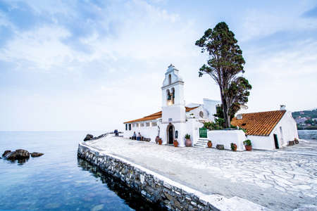 Beautiful charming optimistic view of Vlacherna Monastery on the Kanoni peninsula in Kerkyra, Corfu, Greece. popular tourist attractions. amazing places.の写真素材