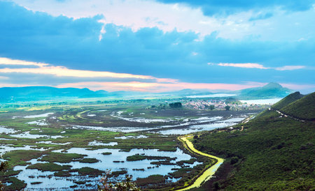 Fabulous beautiful magic dawn with small reservoirs and a yellow riveron the coast of the Ionian Sea in Greece. Amazing places.の写真素材