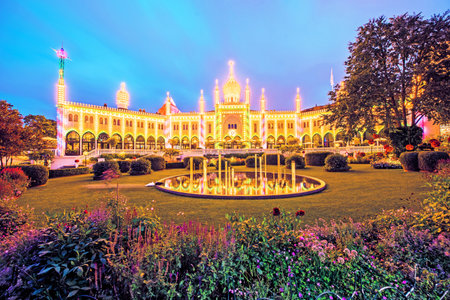 Copenhagen, Denmark â August, 15: Tivoli's Moorish Palace in the evening illuminations and the fountain in Tivoli Gardens in Copenhagen, Denmark on August 15, 2019. Popular tourist atraction.のeditorial素材