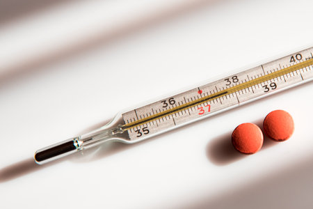 Abstract image of a thermometer with high temperature and medication (Ð¡ovid - concept).の写真素材
